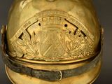 a gold helmet with a coat of arms on it