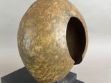 an image of a sculpture of a sphere on a black base