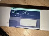 a box of neo panel heater sitting on the floor