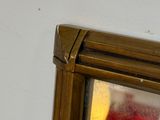 a reflection of a lamp in a mirror on the wall