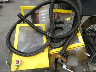 a yellow box with a black hose and a yellow box with a black hose and a yellow box with a black hose and a yellow box with a black
