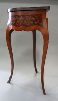 an image of a small table with a drawer on it