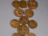 a pile of coins sitting on top of a white table