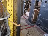 a fork lift in a large warehouse with boxes on the floor