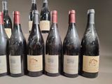 several bottles of wine are lined up in a row on a table