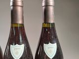 three bottles of wine that are sitting on a table