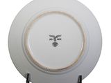 an image of a white plate with a black eagle on it