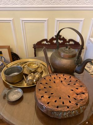 a table with a tea pot, tea pot and other items on it