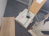 a computer and a printer on the floor in a room