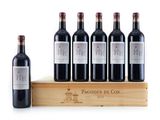 six bottles of red wine sit on a wooden crate next to a bottle of wine
