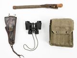 a pair of binoculars and a wooden stick on a white surface