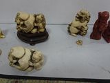 a lot of small statues that are on a table