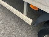 a close up of the side of a truck with a flat tire