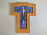 a cross made out of paper with a man on it