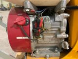 a close up view of a small engine on a trailer