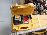 a yellow tool box with tools in it sitting on a pallet