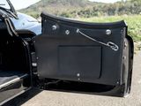 a black car with its door open and the back door open