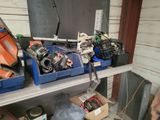 many tools on a shelf in a garage