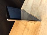 a tablet computer sitting on top of a wooden table