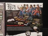 the box for the video game teen ' s evil is shown on a black surface