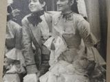 a black and white photo of a man and a woman in a wedding dress