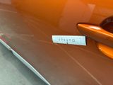 a close up of a car door handle with a sticker on it