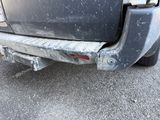 a close up of a car that is parked on the street