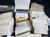 a pile of old envelopes sitting on a table