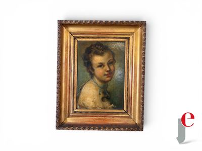 portrait of a young boy in a gold frame with a black bow tie