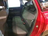 a red car that is sitting in the back of the car