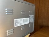 a metal box with a label on it sitting on a table