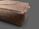 a brown bag that is sitting on top of a table