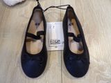 a pair of shoes that are on a wooden floor