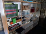 a shelf with many different items on it in a room