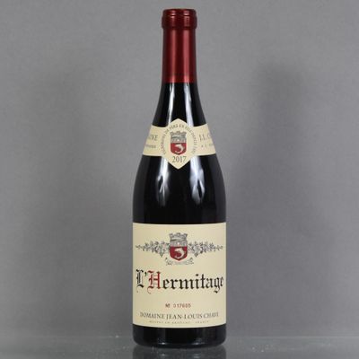 a close up of a bottle of wine on a table