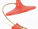 an image of a red table lamp with a gold base