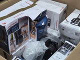 a cardboard box full of electronics and other items in it