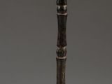 an image of a wooden pole with a wooden handle on it