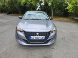 the front view of a silver car parked on the side of the road
