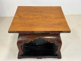 an old wooden table with a drawer underneath it on a white floor