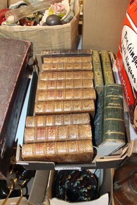 many old books on a table in a room