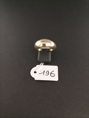 a close up of a metal object with a tag on it