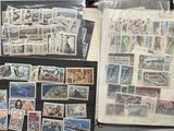 many different types of stamps on the table