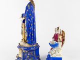 two figurines of the virgin mary and the child jesus