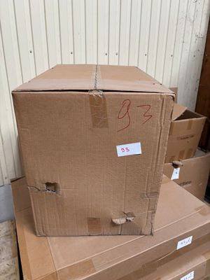 a stack of boxes sitting on top of a pile of boxes