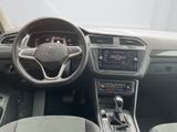 the interior of a car with a steering wheel, dashboard, and dashboard controls