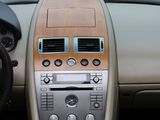 a dashboard of a car with a steering wheel and dashboard controls