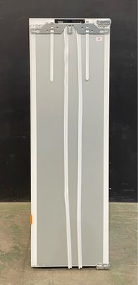 an image of a refrigerator in a room with a black wall