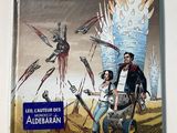 the front cover of a comic book with a picture of a man and a woman in front of a giant