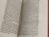 an open book that is sitting on a table